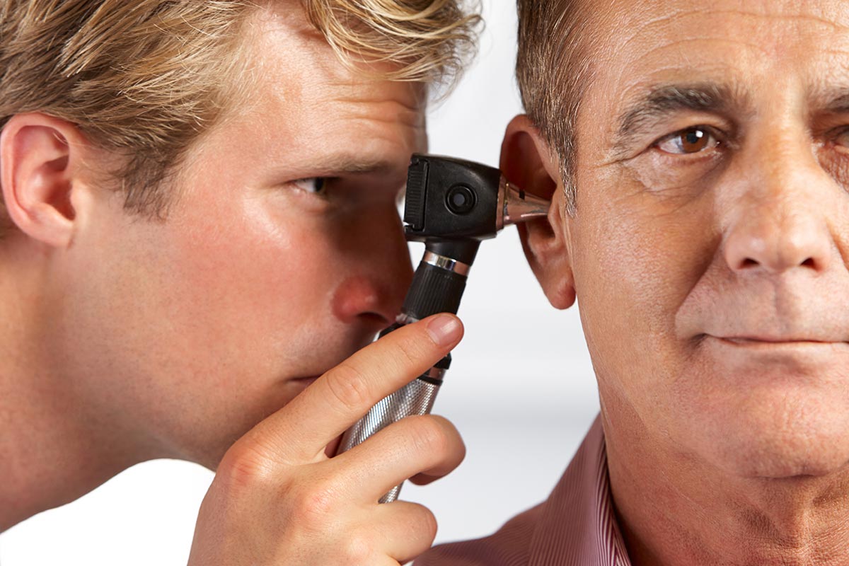 man getting ears checked